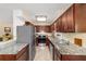 Well-equipped kitchen with stainless steel appliances, granite countertops, and ample cabinet space at 16405 Se 90Th Ct, Summerfield, FL 34491