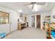 Bright, open area with white walls and ceiling, includes sink, shelving, and adjacent doorways at 16405 Se 90Th Ct, Summerfield, FL 34491