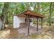 The carport-style area to the shed is full of neatly stacked firewood at 16405 Se 90Th Ct, Summerfield, FL 34491