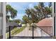 View from the balcony of a home with a tile roof and mature trees at 1718 Sw 27Th St, Ocala, FL 34471
