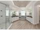A spacious bathroom showcases dual vanities, a walk-in shower, and a soaking tub at 1718 Sw 27Th St, Ocala, FL 34471