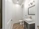 Modern powder room with vessel sink, gray vanity, and wood-look floors at 1718 Sw 27Th St, Ocala, FL 34471