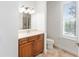 Bathroom with modern fixtures, wood cabinets, and neutral countertops at 1718 Sw 27Th St, Ocala, FL 34471