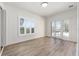 Bright bedroom with plantation shutters, French doors, and wood flooring at 1718 Sw 27Th St, Ocala, FL 34471