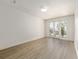 Bright bedroom with hardwood floors and a glass door leading to the balcony at 1718 Sw 27Th St, Ocala, FL 34471