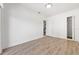 Empty bedroom with wood floors and access to walk-in closet and ensuite bath at 1718 Sw 27Th St, Ocala, FL 34471