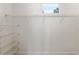 White walk-in closet with metal shelving and a small window at 1718 Sw 27Th St, Ocala, FL 34471