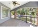 Covered patio featuring an archway, stone columns, and a view of the lush green backyard at 1718 Sw 27Th St, Ocala, FL 34471