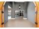 Grand entryway showcasing high ceilings, gray textured walls and unique light fixture with a view of the pool at 1718 Sw 27Th St, Ocala, FL 34471