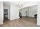Bright, open living space featuring wood-look flooring, modern lighting, and staircase at 1718 Sw 27Th St, Ocala, FL 34471