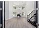 Bright, grand living room featuring soaring ceilings, large windows, and a classic grand piano at 1718 Sw 27Th St, Ocala, FL 34471