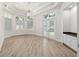Bright and spacious living area with French doors, custom cabinetry, and wood-look flooring at 1718 Sw 27Th St, Ocala, FL 34471