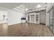 Spacious living room featuring wood floors, high ceilings, and custom built-in shelving at 1718 Sw 27Th St, Ocala, FL 34471