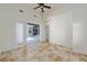 Spacious living room with views of the pool area through large glass doors, and tile flooring at 1718 Sw 27Th St, Ocala, FL 34471