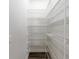 Walk-in pantry with white wire shelving providing ample storage space at 1718 Sw 27Th St, Ocala, FL 34471