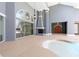 Spacious pool area with fireplace, high ceilings, and sliding glass doors that offer seamless indoor-outdoor living at 1718 Sw 27Th St, Ocala, FL 34471