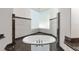 A garden tub is illuminated by a window and surrounded by granite at 1718 Sw 27Th St, Ocala, FL 34471