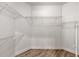 Walk-in closet with wire shelving and wood-look flooring for organized storage at 1718 Sw 27Th St, Ocala, FL 34471