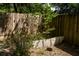Backyard with a wooden fence and some greenery, providing privacy and a natural touch at 2161 Ne 38Th St, Ocala, FL 34479