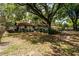 Expansive backyard featuring mature trees offering ample shade, enhancing the property's outdoor appeal at 2161 Ne 38Th St, Ocala, FL 34479
