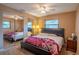 Bedroom featuring a large mirror that visually expands the room, plus natural light at 2161 Ne 38Th St, Ocala, FL 34479