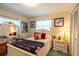 Cozy bedroom with bright, natural light coming through two windows and a comfortable bed at 2161 Ne 38Th St, Ocala, FL 34479