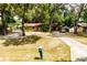 Charming single-story home with a long driveway and mature trees providing ample shade at 2161 Ne 38Th St, Ocala, FL 34479