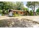 Charming home with a well-maintained yard, located on a spacious lot with mature landscaping at 2161 Ne 38Th St, Ocala, FL 34479