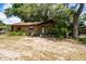 Charming one-story home featuring a welcoming porch and mature landscaping at 2161 Ne 38Th St, Ocala, FL 34479