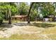 Charming single-story home with a well-manicured front yard and an attached garage/carport at 2161 Ne 38Th St, Ocala, FL 34479