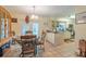 Bright eat-in kitchen with tile floors, dining table, and sliding door to the outside at 2161 Ne 38Th St, Ocala, FL 34479