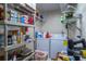 Functional laundry room provides ample storage with wire shelves, plus washer and dryer at 2161 Ne 38Th St, Ocala, FL 34479