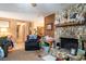 Open living area with stone fireplace and view of hallway and dining area at 2161 Ne 38Th St, Ocala, FL 34479