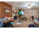Comfortable living room with a unique stone fireplace and wood paneling at 2161 Ne 38Th St, Ocala, FL 34479