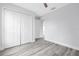 Bedroom with gray flooring, a ceiling fan, and a double door closet at 2329 Sw 143Rd Ct, Ocala, FL 34481