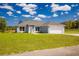 Charming one-story home with a well-manicured lawn and attached two-car garage at 2329 Sw 143Rd Ct, Ocala, FL 34481