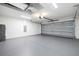 Spacious garage with automatic door and sealed concrete floors at 2329 Sw 143Rd Ct, Ocala, FL 34481