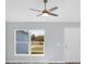 Bright and airy living room with a modern ceiling fan and view of the front yard at 2329 Sw 143Rd Ct, Ocala, FL 34481