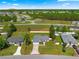 Aerial view showing home's layout with a fenced yard, mature trees and a long driveway at 27 Juniper Dr, Ocala, FL 34480