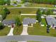Charming single-Gathering home with attached garage, well-manicured lawn, and a partially fenced backyard at 27 Juniper Dr, Ocala, FL 34480