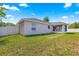 The spacious backyard is surrounded by a privacy fence and features a screened porch at 27 Juniper Dr, Ocala, FL 34480