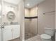 Stylish bathroom featuring tiled shower, vanity with countertop, and modern fixtures at 27 Juniper Dr, Ocala, FL 34480