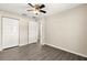 This spacious bedroom features wood floors, a ceiling fan and a large closet at 27 Juniper Dr, Ocala, FL 34480