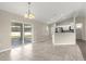 Bright dining area with sliding glass doors, tile floors, and an open concept layout at 27 Juniper Dr, Ocala, FL 34480