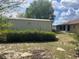 Backyard with shed and home with a screened porch at 2730 Sw 173Rd Place Rd, Ocala, FL 34473