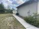 Home exterior with back lawn, small shed, and AC unit at 2730 Sw 173Rd Place Rd, Ocala, FL 34473