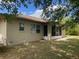 Home exterior showing screened patio and backyard with lawn at 2730 Sw 173Rd Place Rd, Ocala, FL 34473