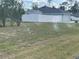 Spacious backyard with manicured lawn and an irrigation system at 2730 Sw 173Rd Place Rd, Ocala, FL 34473