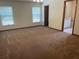 Spacious bedroom with carpet flooring, natural light, and neutral walls at 2730 Sw 173Rd Place Rd, Ocala, FL 34473