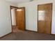 Spacious bedroom with closet and entry doors, and neutral colored carpet at 2730 Sw 173Rd Place Rd, Ocala, FL 34473
